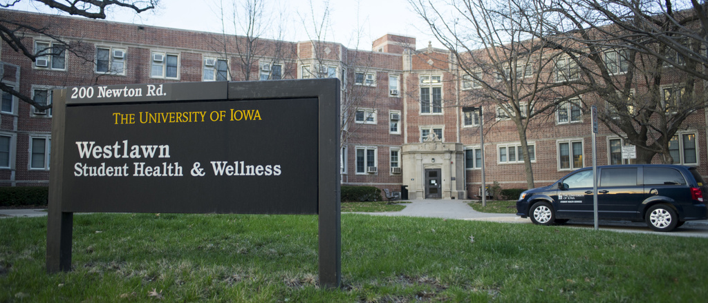 student health building with sign on lawn