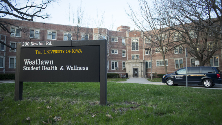 student health building with sign on lawn